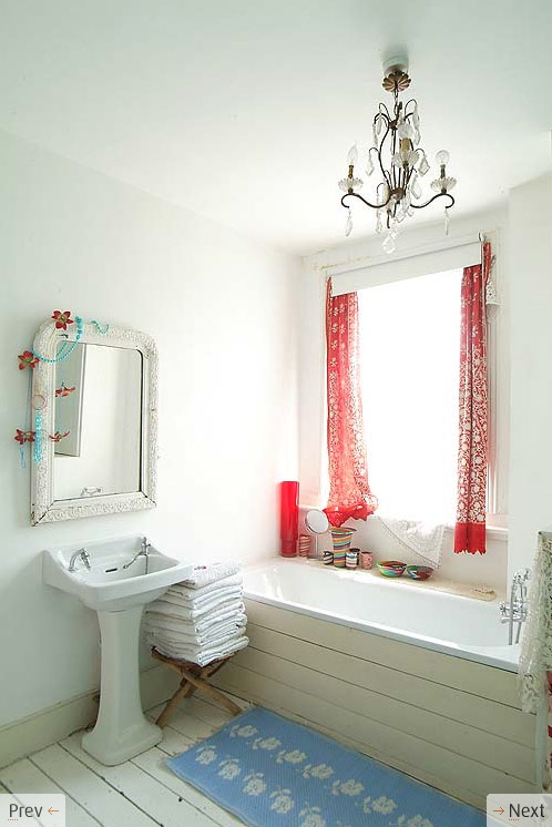 white bath red curtains