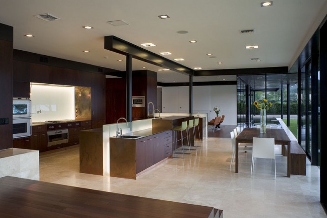 The modern and sleek open kitchen and dining area.