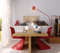 A clean and simple office space is accessorized with a spacious wooden table and unusual modern chairs. The pops of red in the lamp and chairs give life to the room.