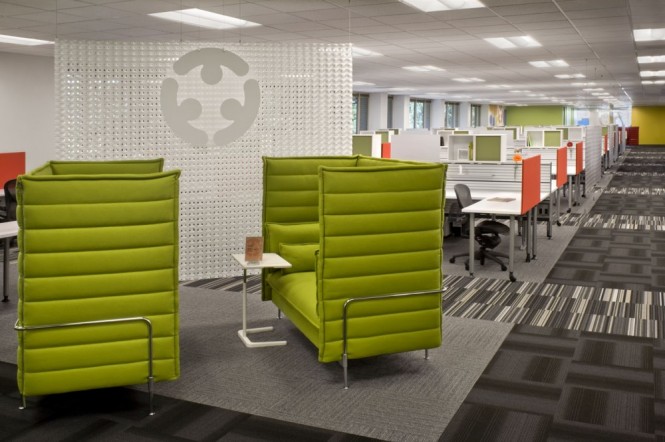 Screens like these in this sitting area, were installed to provide privacy for those seated employees without obstructing views. They also provide whiteboards and printer stations.
