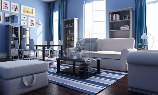 This is a blue and white, nautical, beach-house living room complete with striped rug, comfortable white furniture, and beachy wall art.