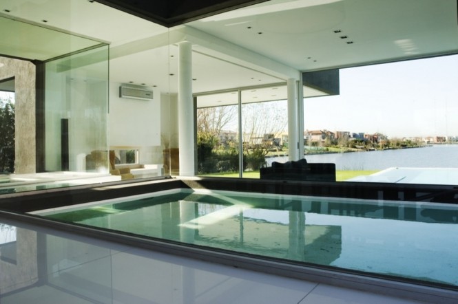The glass walls allow a full view of the lake from the living room.