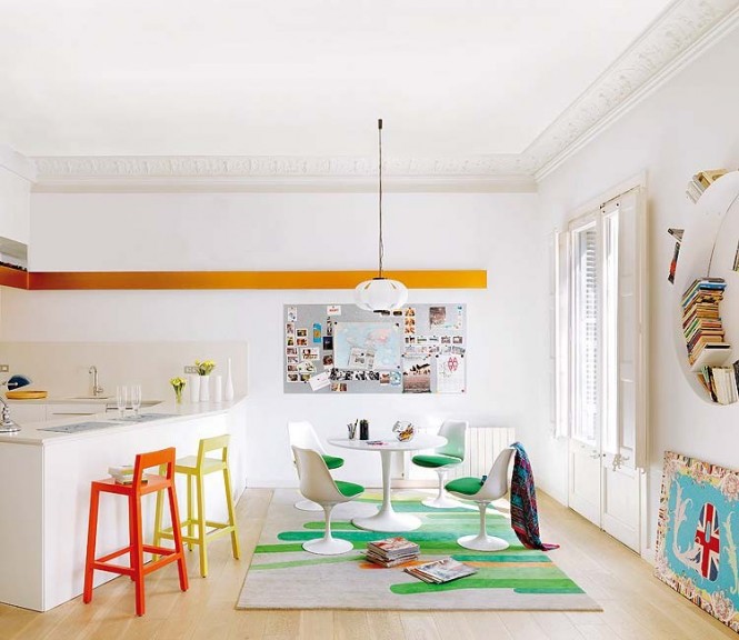 The bar stools mismatch in color while the breakfast nook holds its own with green and white mod decor.