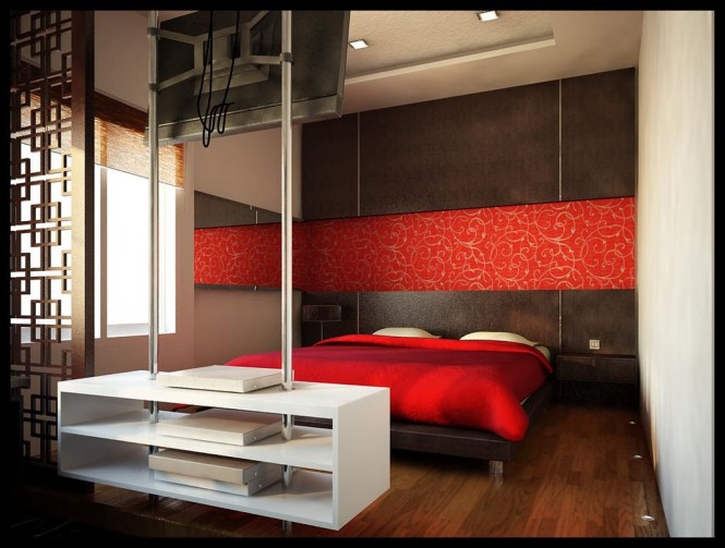Design by San Samuel. This ultra modern red and white bedroom is accented by dark wooden wall panels and matching floor. The red banner with a graphic white design running across the wall,  opens up the space even more.
