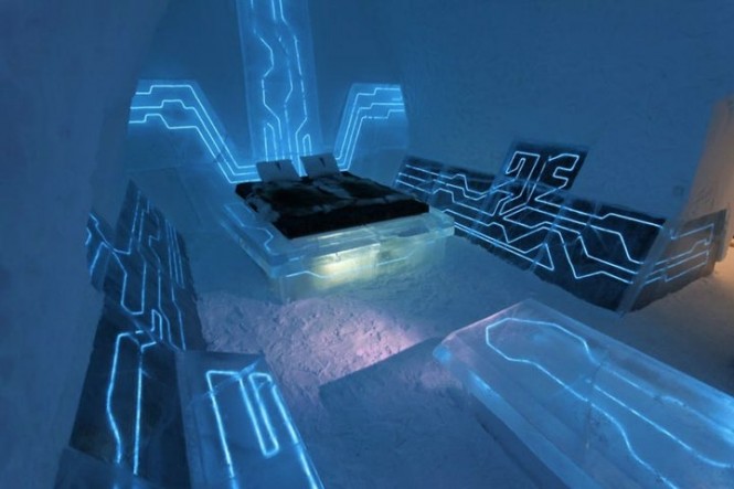 The Tron movie inspired hotel room in Sweden wouldn't sit too well with Feng Shui followers who believe in eradicating technology from the bedroom, as this space feels pretty much like you're sleeping in a computer chip, a very blue, glowing, computer chip.