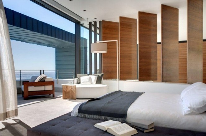 Contemporary neutral bedroom with balcony