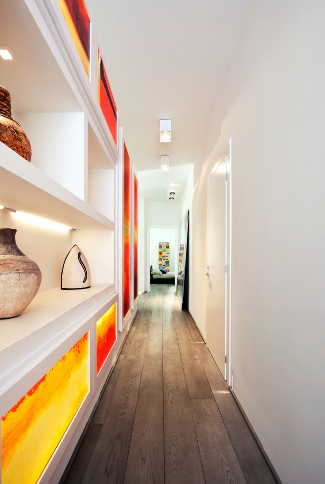 Backlit printed Plexiglas panels adorn a gallery-like hallway