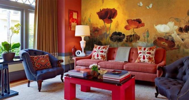 A wall-to-wall flower mural creates a dramatic backdrop in this living room, and ties in the black, red and cream color story.