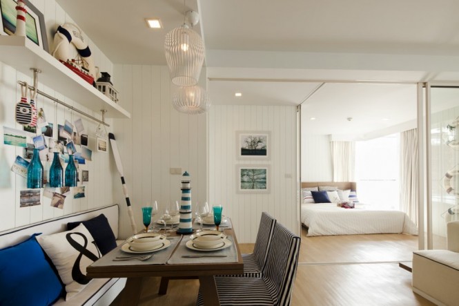 The beach theme continues in the interior design of the apartments, with nautical memorabilia scattered over walls and display shelves, and the same blue and white color scheme we see begin at the sales office.