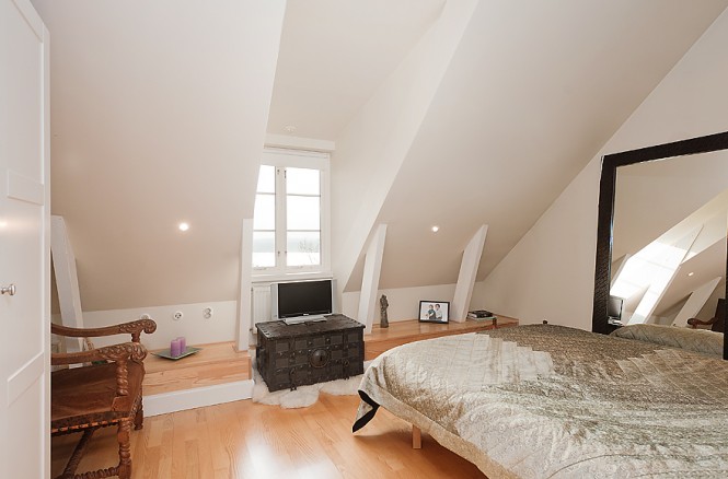 neutral white attic bedroom