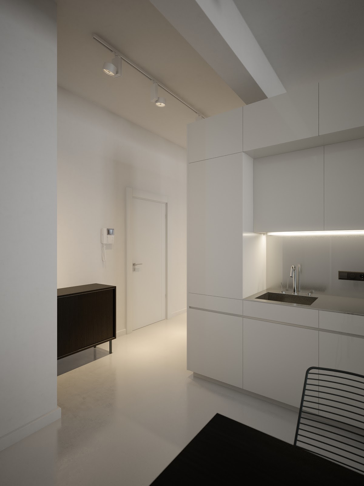 The White Slab Front Kitchen Units Are Situated In A Single Run