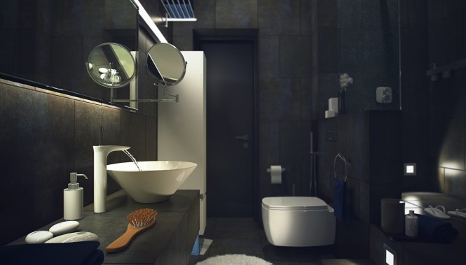 A more dressed dramatic look blankets the bathroom, with dark tiling over walls and floor, brightened only by the punctuation of white sanitary ware. The stark contrast results in an extremely crisp and tailored look, and the addition of a vanity shelf clad in the same large tile makes everything appear seamless, as though the fixtures have organically emerged from the walls themselves.