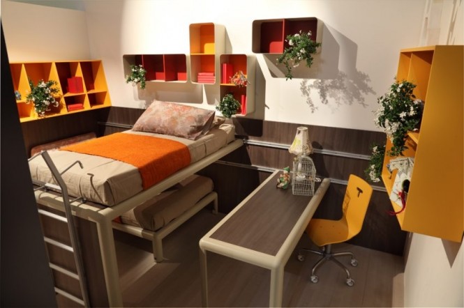 The desk and bunk in this room design are mounted against wall runners, allowing variation of space between areas as needed, and also allowing the study area to be tucked beneath the bed completely when not in use.