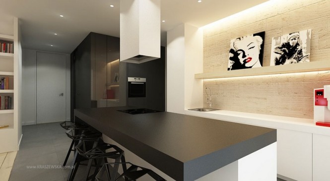 The masculine straight lines in this kitchen layout are given a feminine kick with accents of lipstick red.