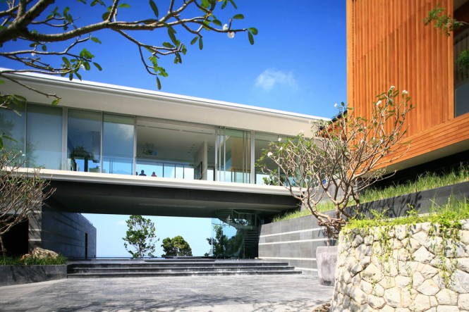 Set upon a podium of granite cobbled walls on a remotely on a private estate, away from the well-trodden tourist tracks, the 3200 sq m build site is situated within the undulating terrain of the island. Soaking up panoramic views of the Andaman Sea and surrounding hills the home is also settled amongst a lush tropical landscape that has been sensitively established by the owner of the development.