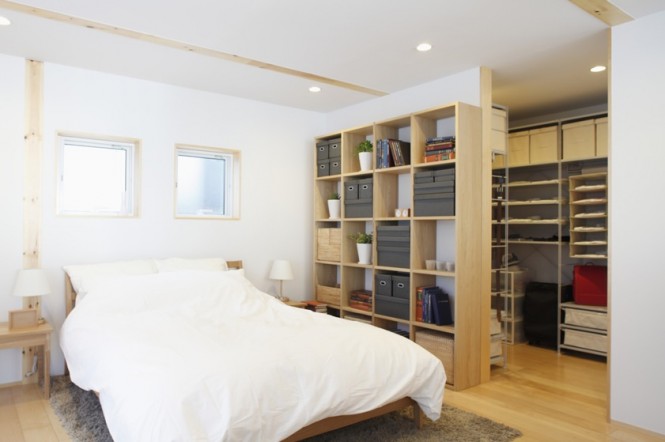 The open plan layout continues even into the bedroom, with an open sided walk-in wardrobe.