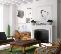 Mid-century modern furnishings and large-format modern photographs give this loft living room a balanced retro and modern feel.
