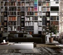 This urban industrial apartment has vaulted ceilings, but in most cases, that just means a lot of empty space above your head. The massive shelving unit takes full advantage of the extra area, letting you stack books all the way up to the top and including a ladder for quick, if precarious access to every level.