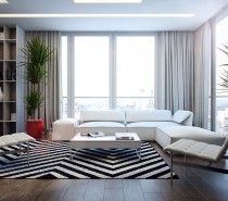 The first apartment has the foundations of a monochrome dream, with striking black and white chevron rug, and snow-white sofa and accent chairs. However, as you wander a little further into the scheme warm notes appear in the form of purposefully placed red home accessories such as a large plant pot and a scattering of rosy vases in the display nooks of the built in bookcase.