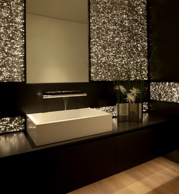 Glamorous wall treatment gives this gorgeous bathroom a glittering nightclub effect.
