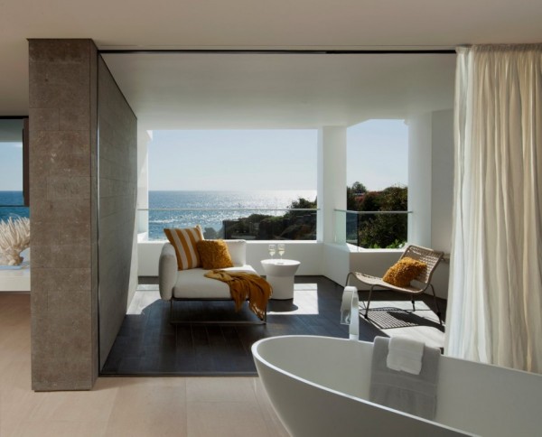 In this bathing space, a tub side lounge area takes in the view.