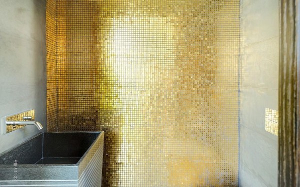 These stunning gold mosaic tiles make this room feel extraordinarily special.