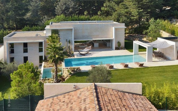 Set on a sun drenched plot amidst woodland and lush Mediterranean planting, the property makes the most of it's prime beauty spot with a heated swimming pool that enables the outdoor space to be enjoyed even in cooler weather.