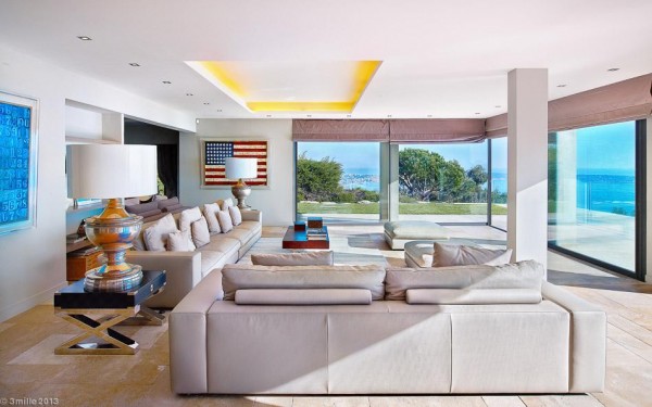 Inside, the interior design schemes are fresh and minimalist. A 150 square meter living room provides ample room for seating a large number of guests or extended family members. Recessed ceiling lights keep the look uncluttered and streamlined, whilst the panorama through the great floor-to-ceiling windows add all of the visual interest anyone would need.