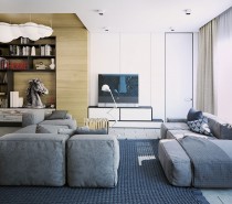 A low level modular sofa gives the living room a laid-back feel, and statement items such as the light-cloud Nemo Nuvola over the library section, the anglepoise standing lamp at the sofa, and the casually floor situated large photography piece, all come together to give this home a young image.