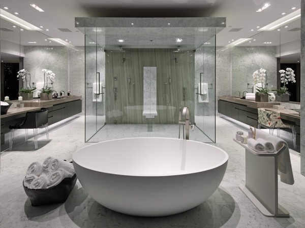 This huge master bathroom also has views overlooking the canyon. Inside the luxury suite, twin rainfall shower heads adorn the massive central shower cubicle, and twin vanity areas span each wall, almost creating a mirror image in the layout.