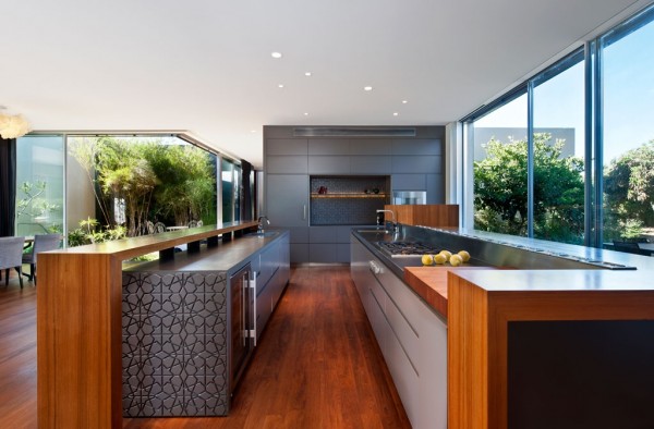 The kitchen is narrow but long with spacious counters, including a gorgeous butcher block.