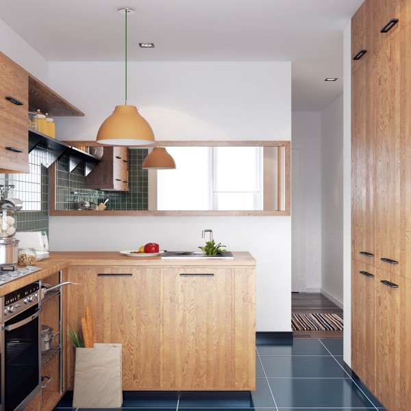 A small kitchen with pretty wood storage and deep blue tiled floors has everything a home chef would need. Except maybe excess counter space.