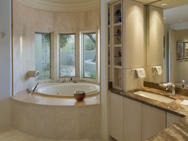 Travertine tiled bathrooms, and a private whirlpool are the final nest of luxury in this enviable home.