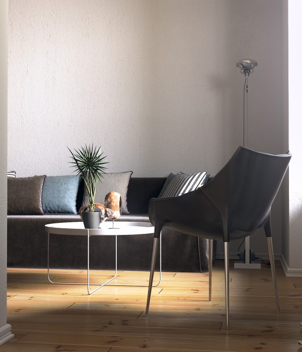 In the living area, the use of clean, simple furnishings like this amazing leather chair and a coffee table on spindly chrome legs, makes the space feel very open.