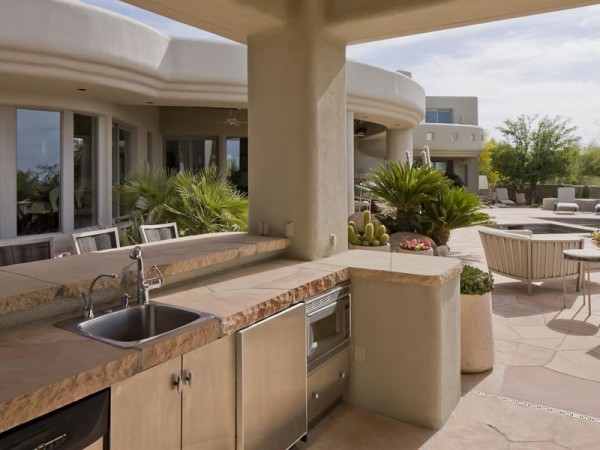 An outdoor wetbar and barbecue area is a dream for the grill enthusiast.