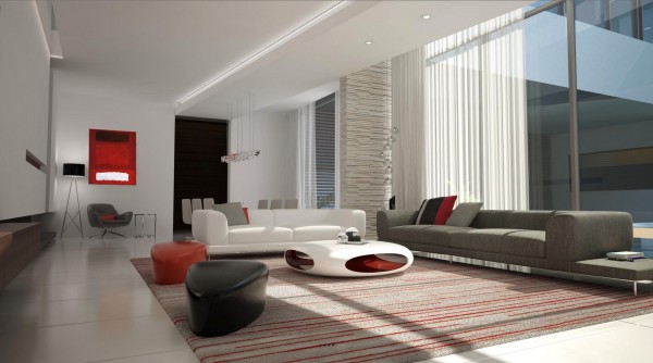 The elliptical coffee table in the center of this spacious and modern living room is a tiny bit retro futuristic. Coupled with the white, grey, and red color scheme you're almost in the Home of the Future. I wonder if there's a refrigerator attached to a telephone hidden somewhere in the kitchen.