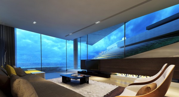 Surrounding by glass and stunning views, the last thing this ultra modern living room needs is the obligatory television.