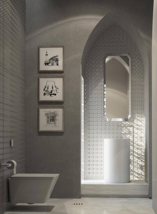 This decidedly modern bathroom uses the Moroccan style as a jumping off point for contemporary decor. The archway, for instance, is a classic example of the Moroccan look, but instead of using brightly colored tile mosaics, here we see flashy silver.
