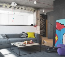 The first creative apartment for a creative person comes from the design and architecture team at NORDES Design Group. At first glance, the cheeky superhero painting in the living room draws the eye entirely. This boldly colored piece is allowed to stand out because so much of the color scheme is neutral gray and white.