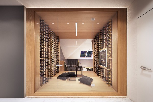 Rather than have a bedroom overlook a downstairs living room, this particular design actually features a private wine cellar flipped on its head. The cellar is upstairs while the entertaining area is below.