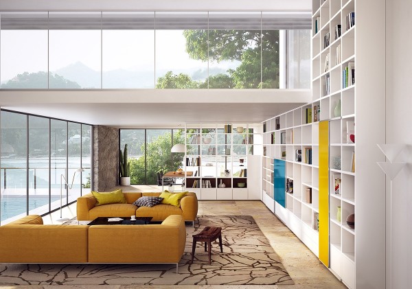 Book lovers rejoice! With shelving that climbs up two stories, this living room and its mustard colored couches are calling to you.
