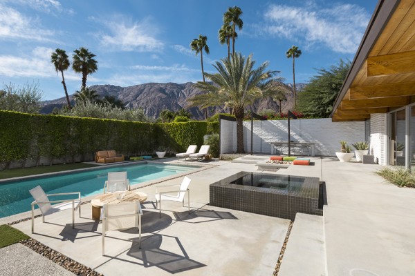 A sparkling blue pool (another Palm Springs necessity) takes over the backyard area of the home with an expansive deck for lounging, dining, and ideally tossing back a cool martini or four. It would be the perfect place to invite your guests if your guest was Frank Sinatra in shorts.