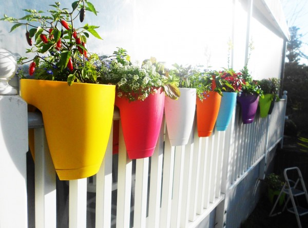 If you don't have a lot of space to work with, these fence planters are perfect for an apartment balcony.