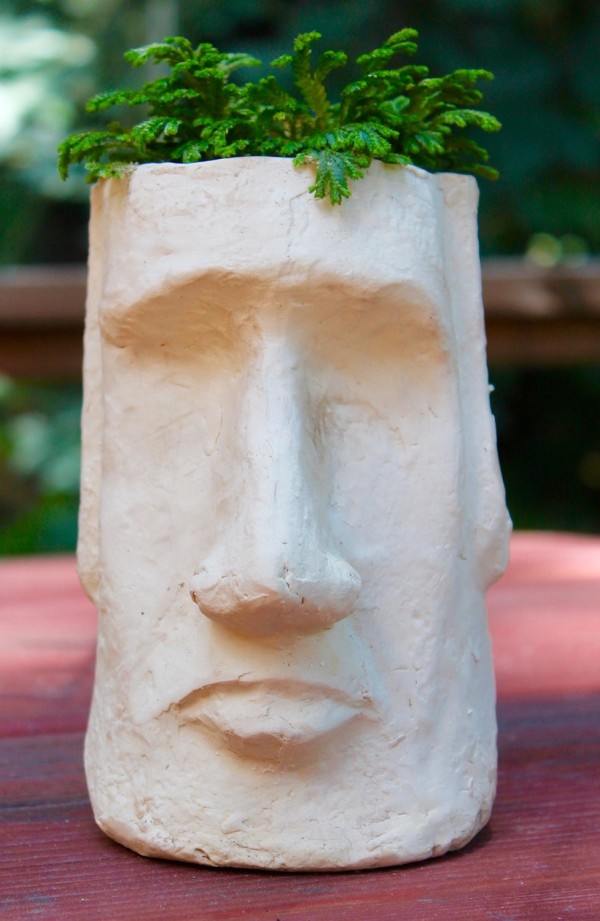 You don't have to journey to a far off island to experience exotic art. This Easter Island Head Planter brings it right to your tabletop.
