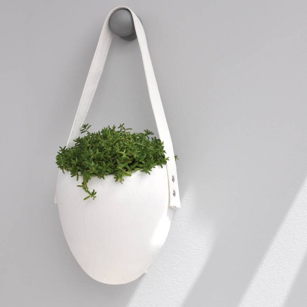 This ceramic hanging planter looks like your tote has become overgrown, but in a cute way.