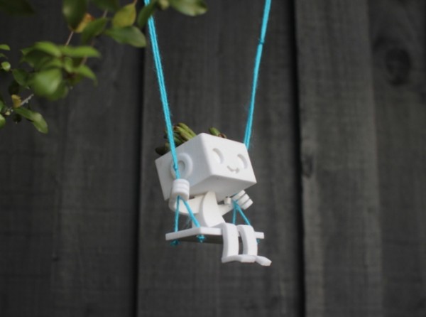 Another cute robot planter option is this little guy on a swing. His friendly face and high flying demeanor is enough to make us all forget about the impending robot uprising.