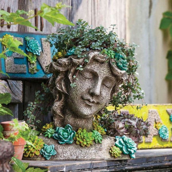 For a different take on the fairy feel, this stone sculpture planter is ideal.