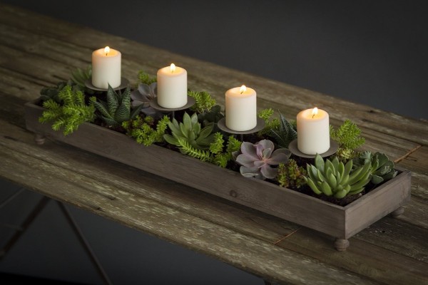 For a planter that easily doubles as a romantic centerpiece, consider this Vagabond Vintage four candle planter.