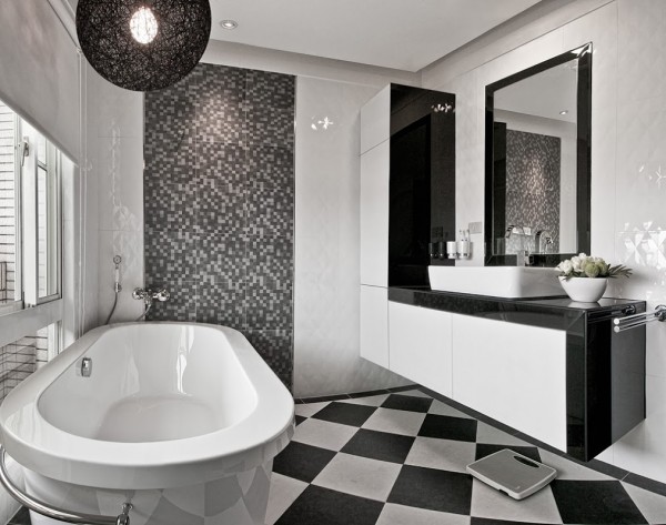 No wood here! The bathroom is purely monochromatic and offers a clean break from the rest of the home. There's nothing wrong with going for a completely different palette in a room as secluded as the bathroom, and in fact, such a bold change can help reset and reframe the mind – and that's what a nice long bath is all about, right?