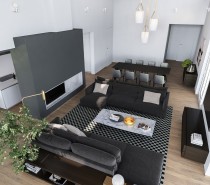 An overhead view reveals the layout to be compact and efficient, using blocks of gray to delineate each area according to function. Dark colors grouped with dark colors create a sense of intimacy and closeness – an impressive feat considering the scale and openness of the layout. The protruding volume of the accent wall separates it from the rest of the space.